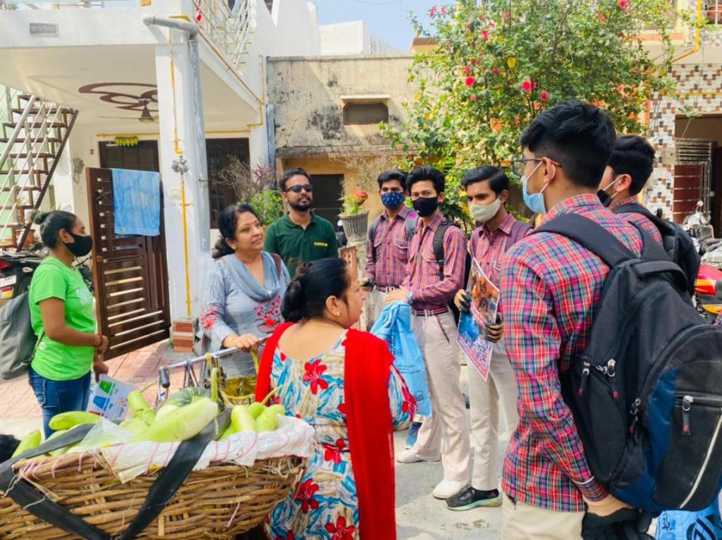 Students of DAV school, Haridwar, educating the residents about waste segregation, as part of a school to community outreach initiative by project Aviral.